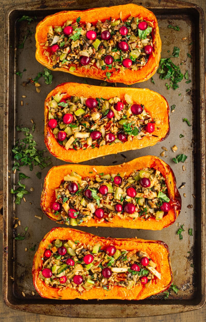 4 stuffed butternut squash on a sheet pan