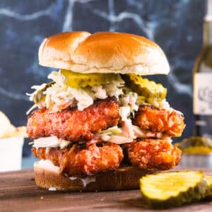 Nashville Hot Tofu Sandwich on a dark cutting board