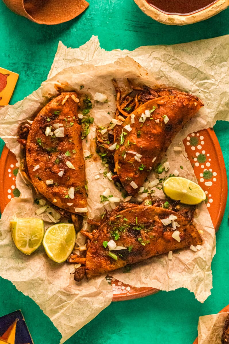 vegan birria tacos on a plate overhead view