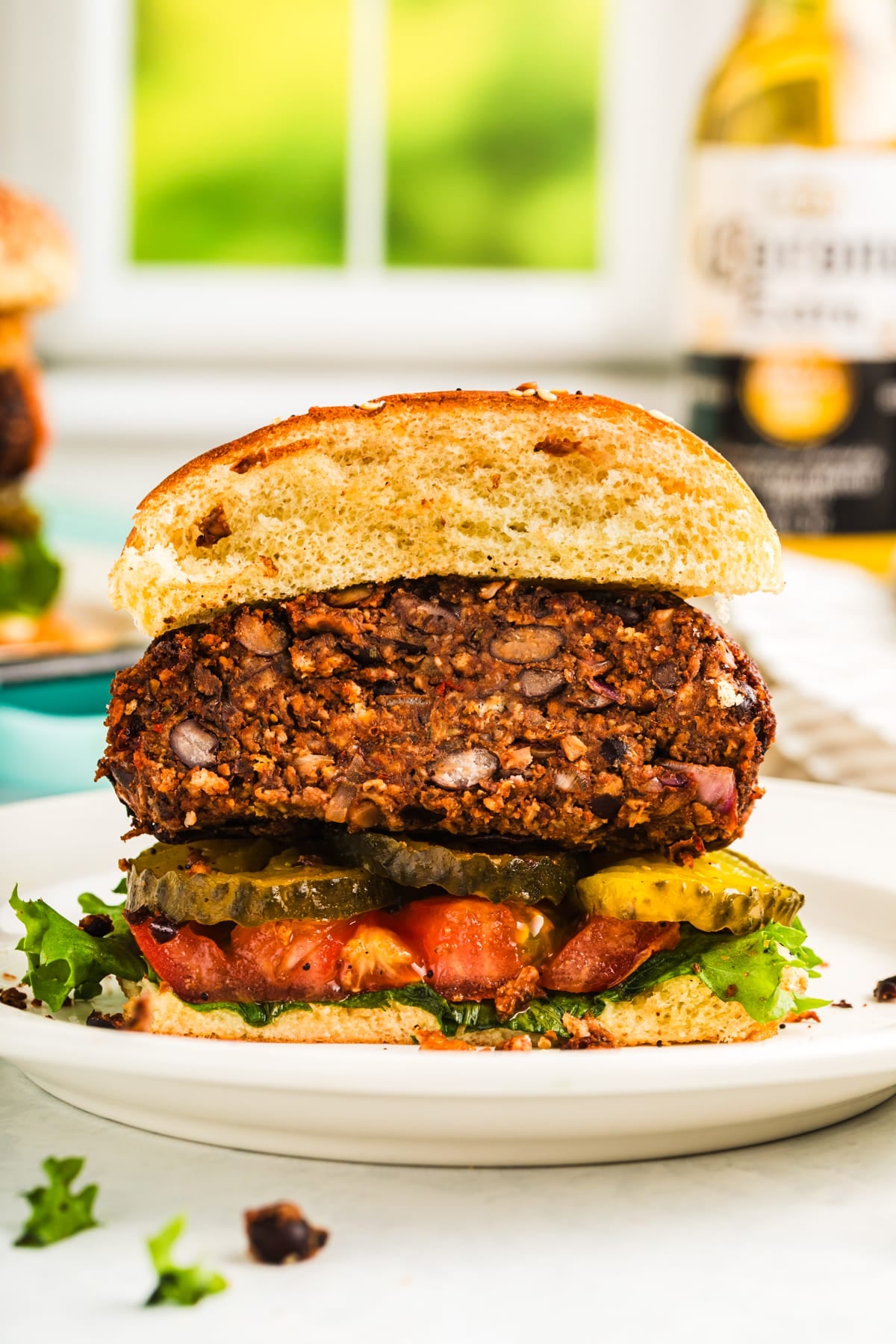 vegan black bean burger cut in half showing the tender, juicy middle