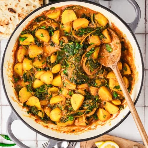 overhead view of a skillet of spinach and potato curry