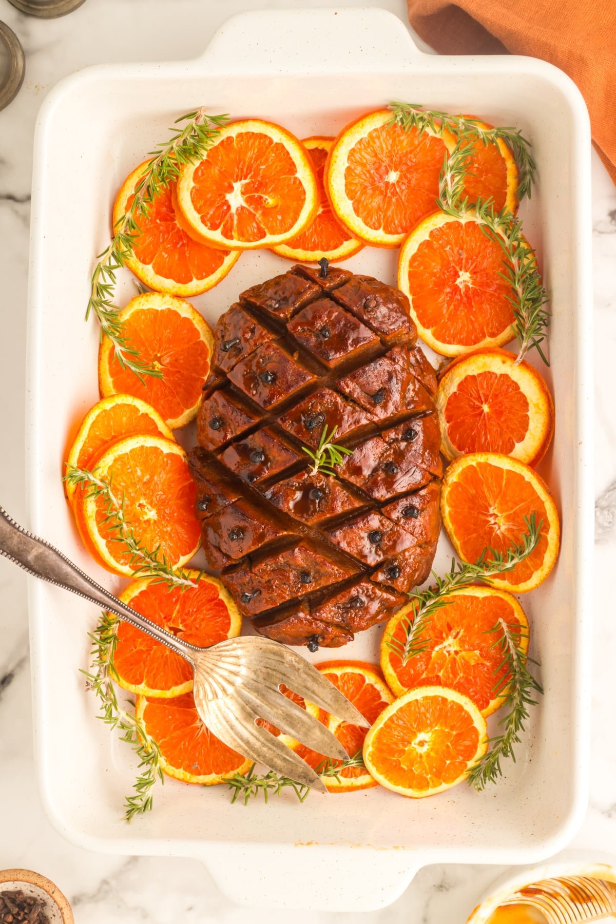 overhead view of vegan ham in a white casserole dish