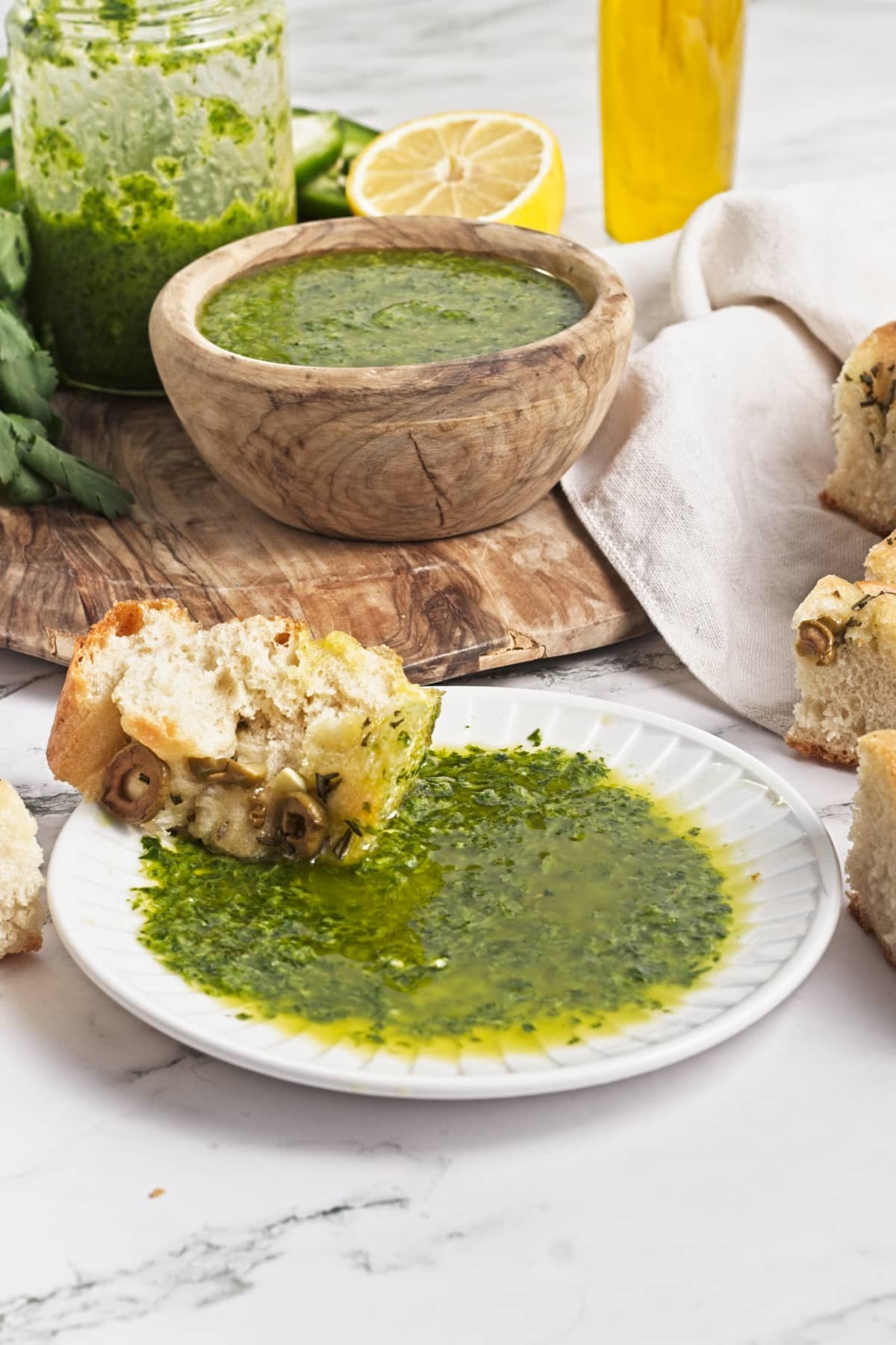 side view of a plate of zhoug sauce used as dipping sauce for bread