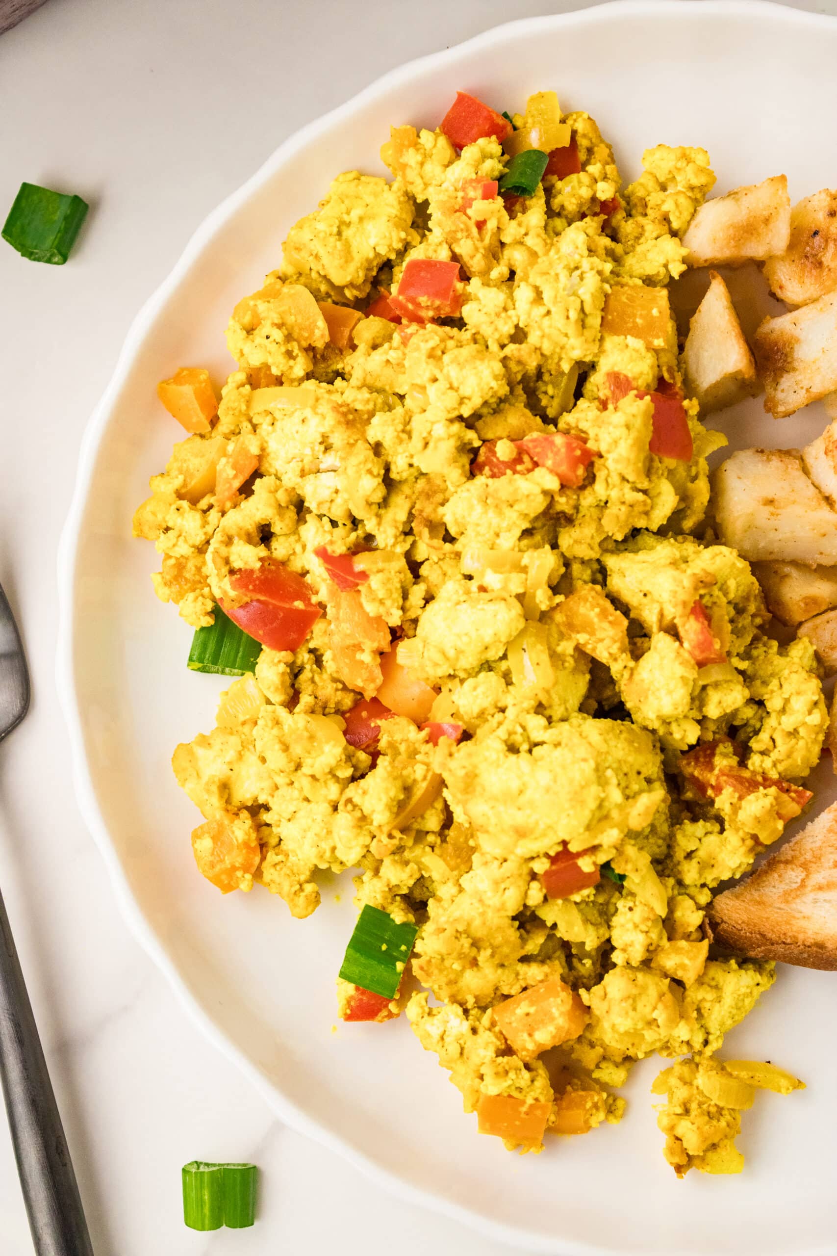 overhead view of tofu scramble on a white plate