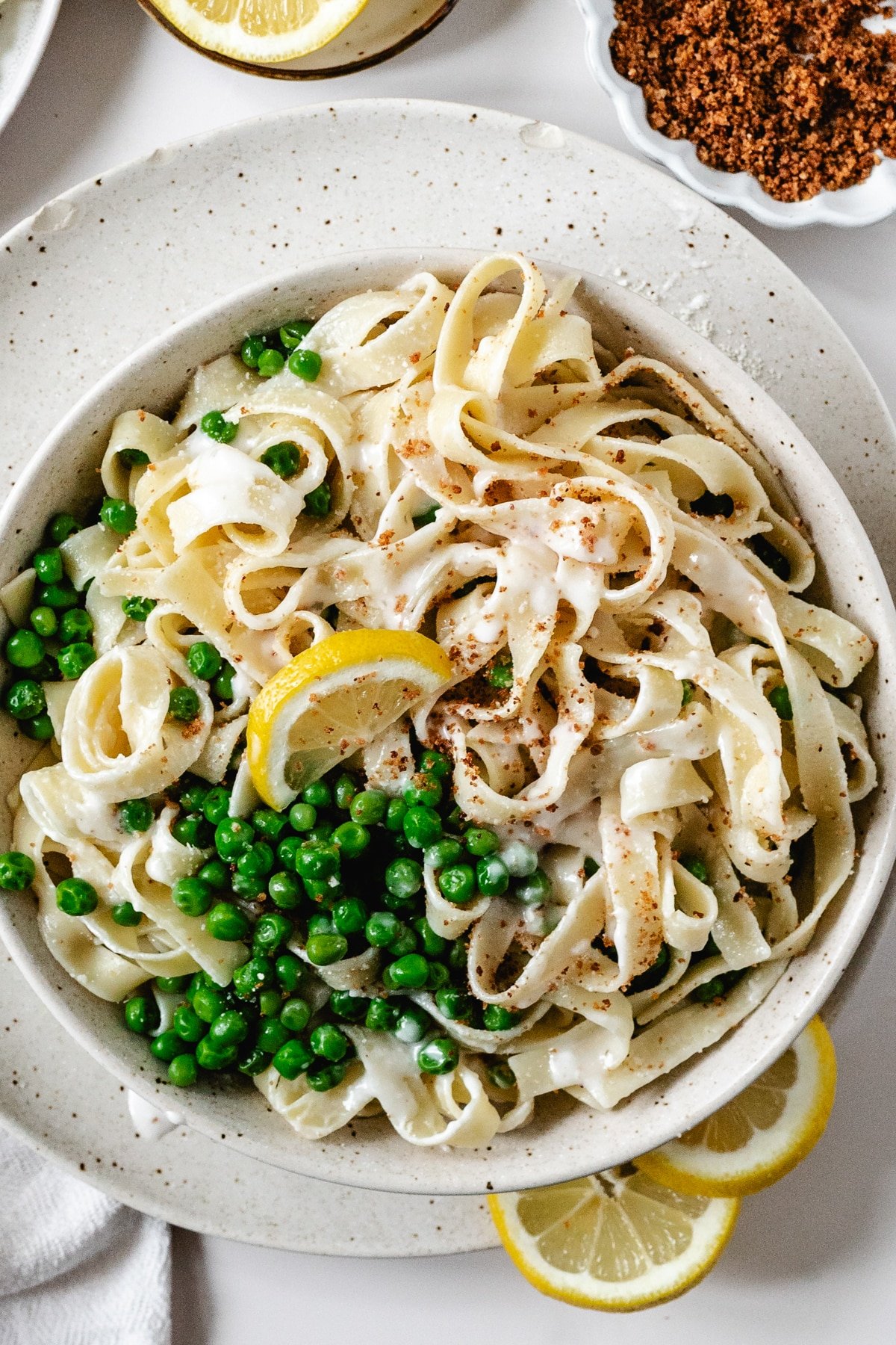 pasta and peas on a white plate