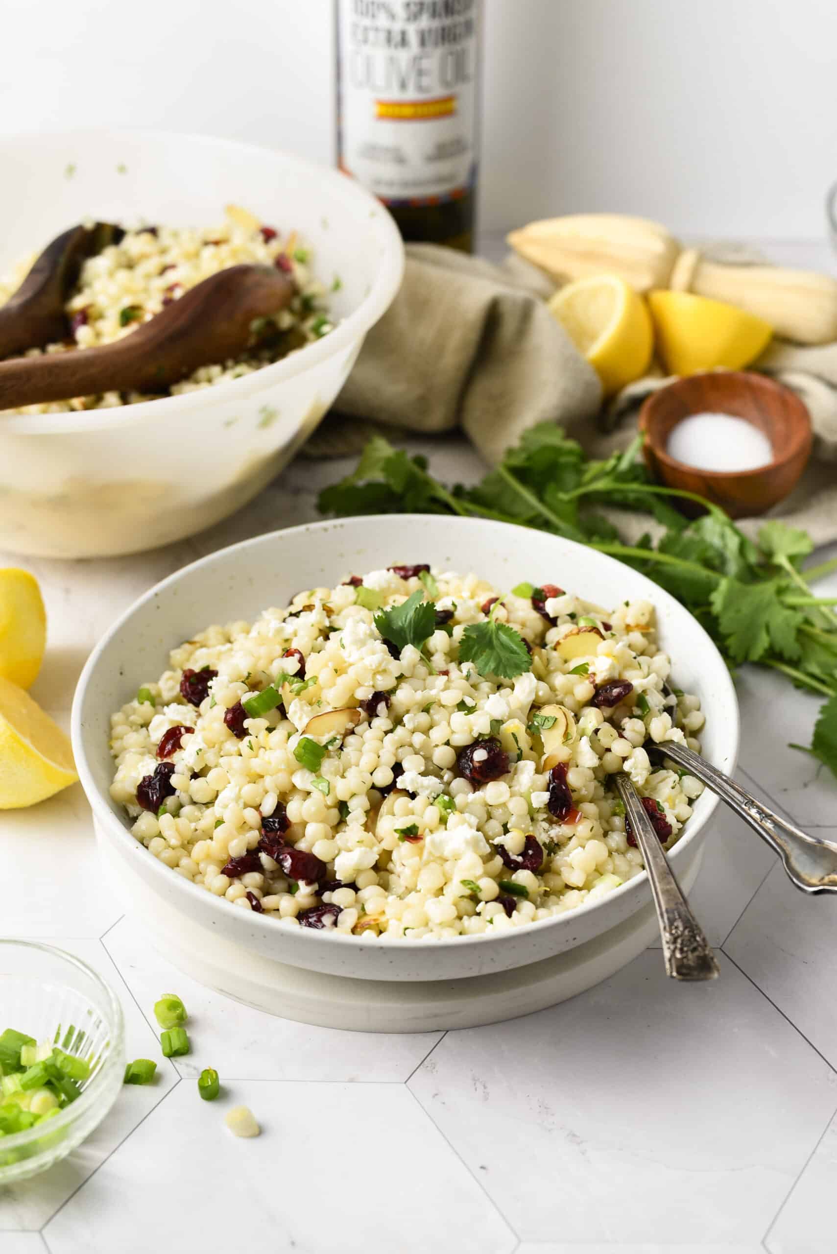 a white bowl of Pearl Couscous Salad