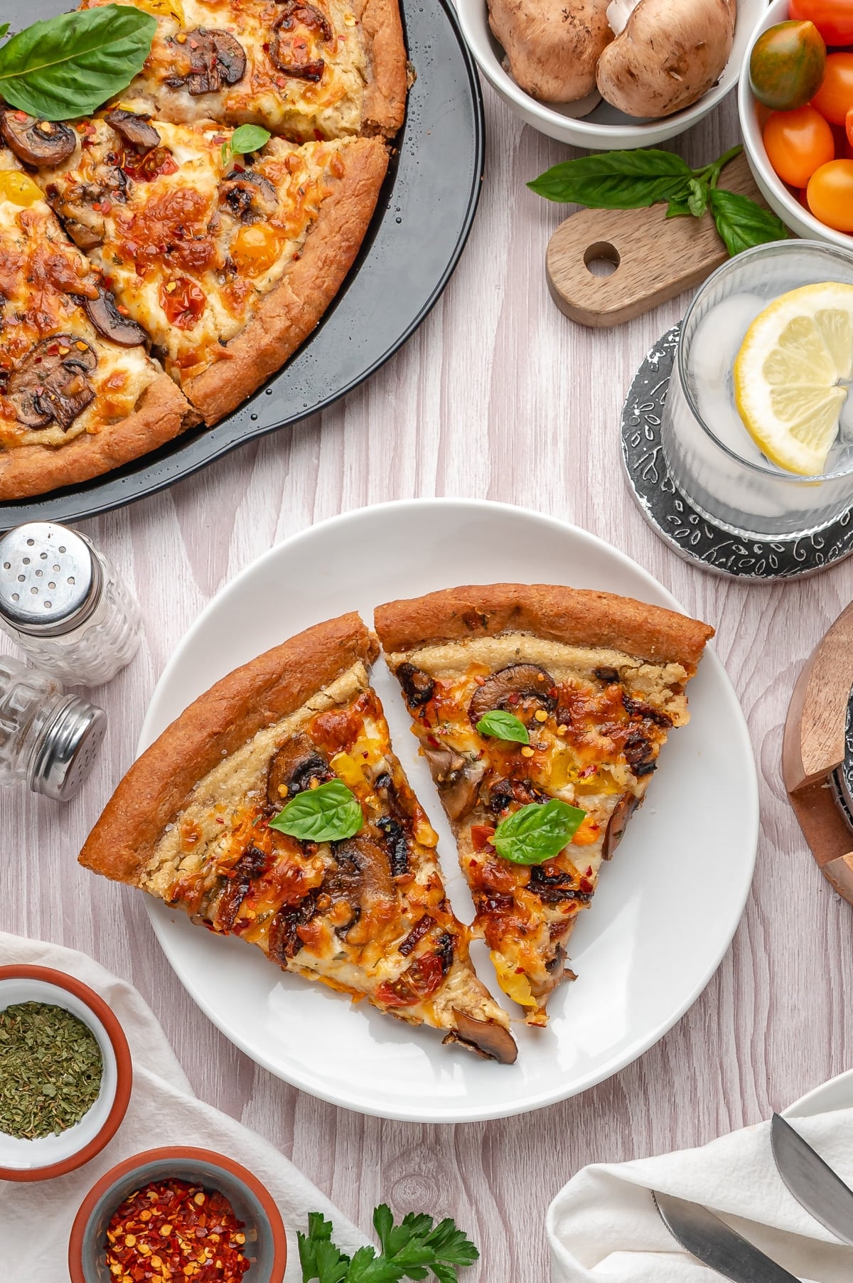 2 slices of vegan piza on a white plate