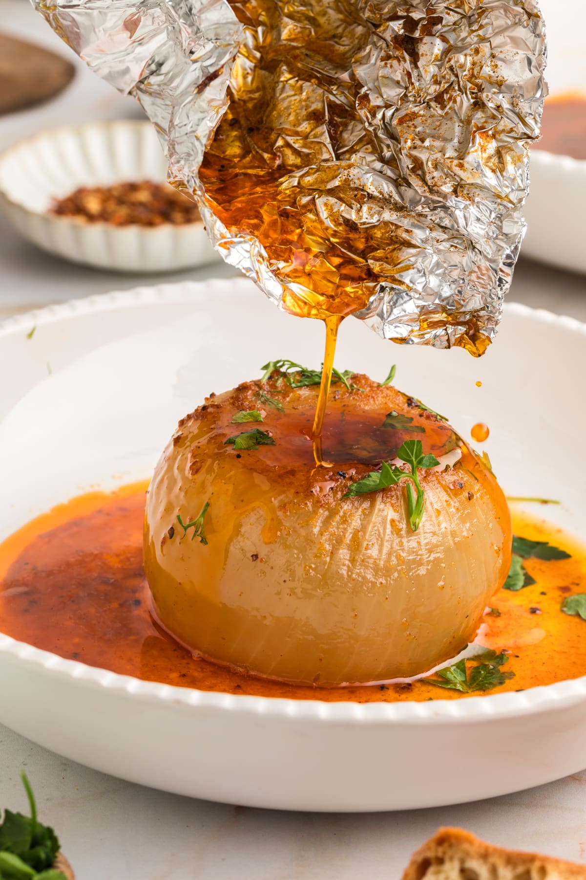 juice dripping from foil packet over the onion boil