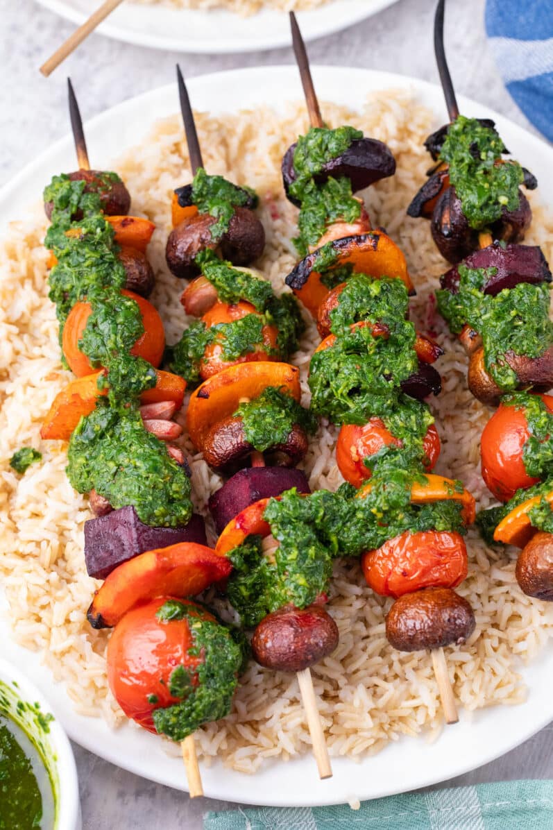 grilled Chilean vegetable kabobs on a bed of rice
